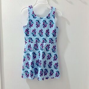 This is a one piece little sun dress with all in one pants.